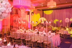 Large candleholders stand on dinner table