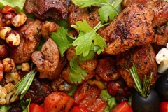 grilled meat on a plate served with vegetables